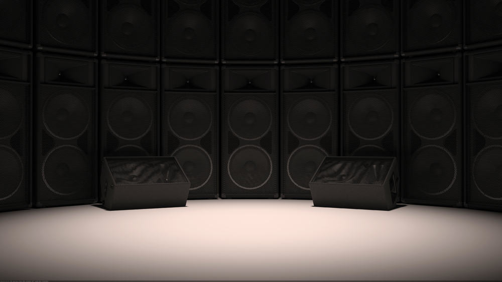 A Set of speakers set up in a studio format on a white surface with a black or dark background