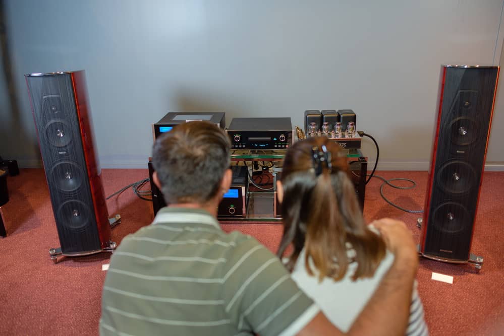 Couple looking at sound system