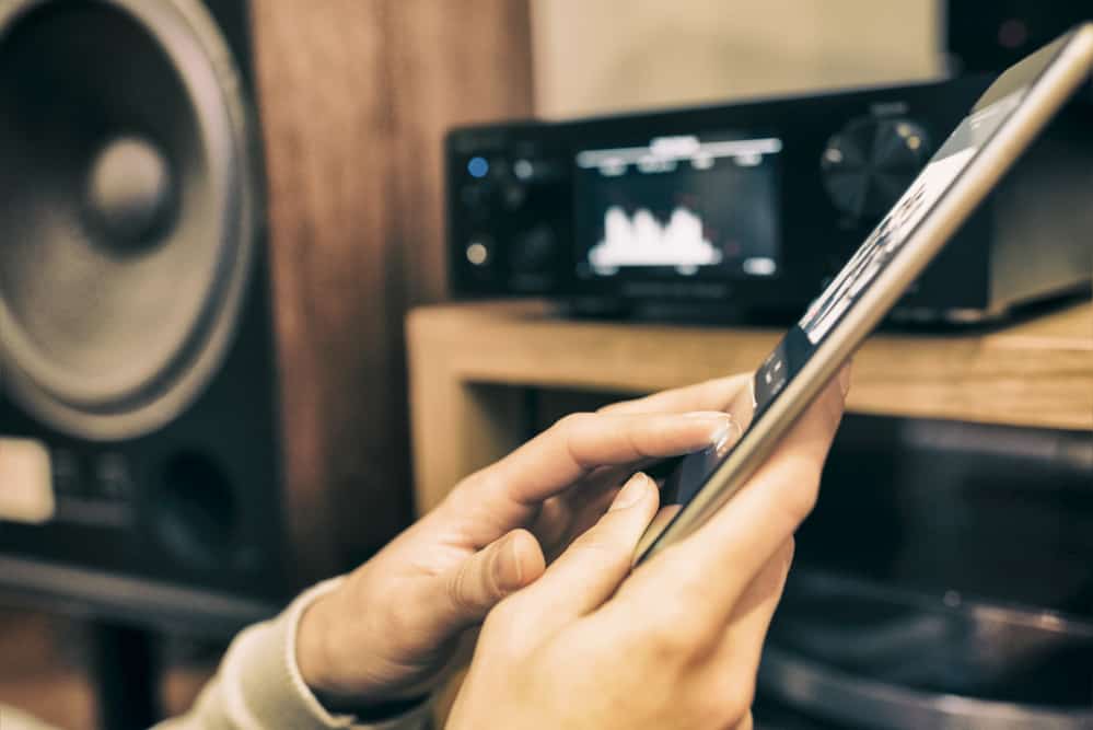 Woman listening music from a tablet